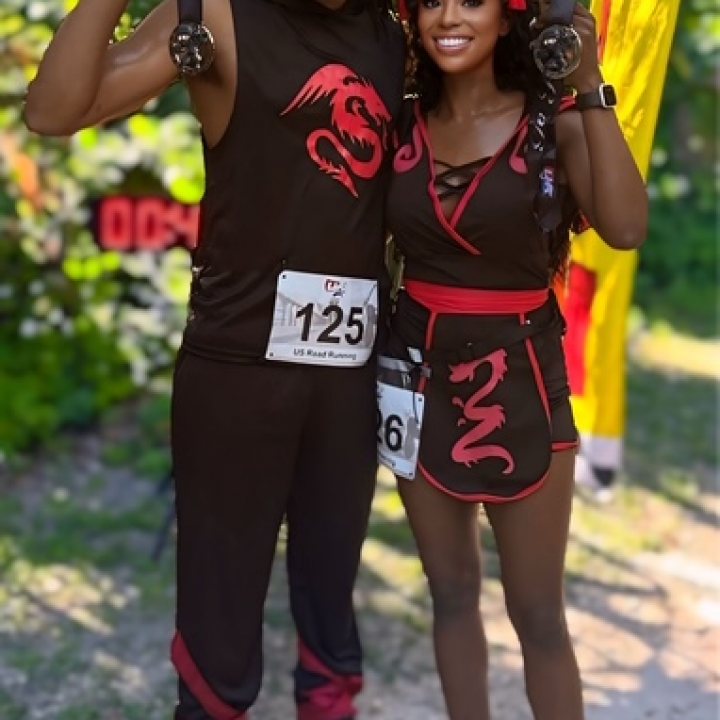 US Road Running race day photo with runners, walkers, finisher medals, and race staff
