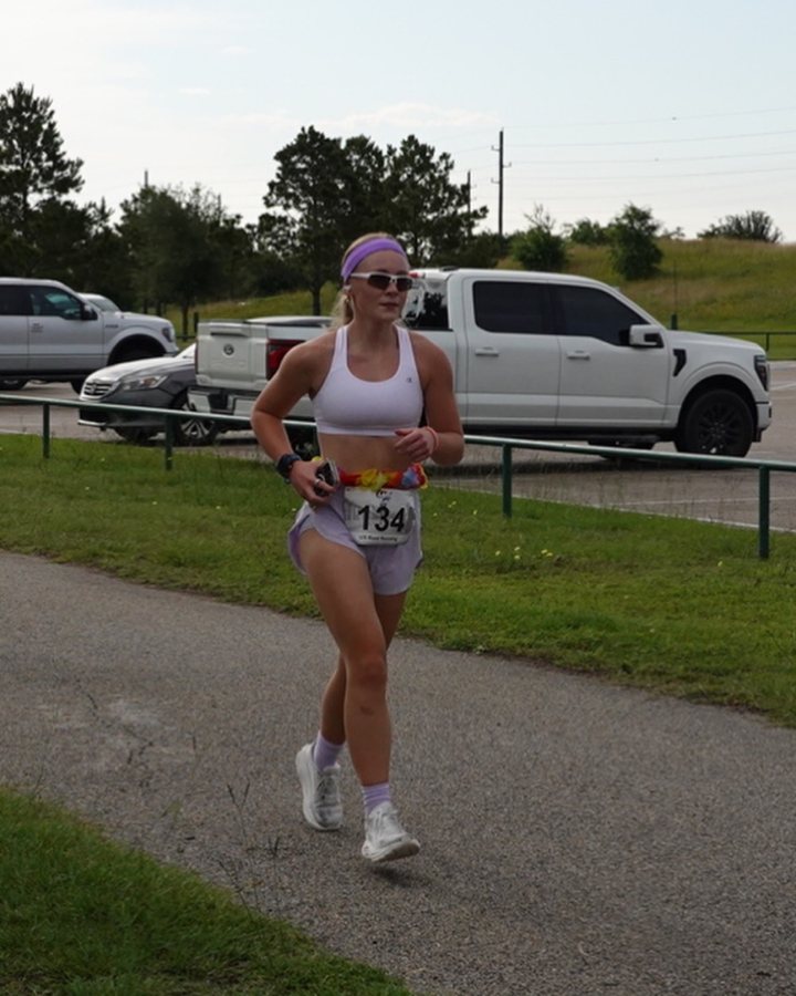 Charley MacNamee at Luau 5K, 10K & 13.1M at Cypress, TX (21) - 05/23/2026 after earning 1st FEMALE Overall