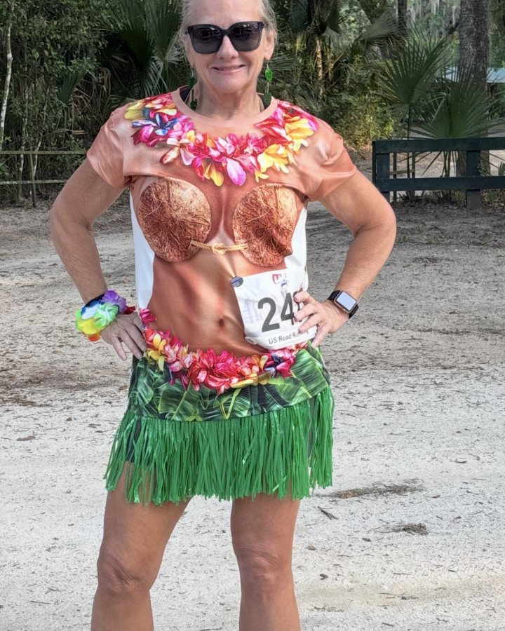 Minokah Lipps at Luau 5K, 10K, & 13.1M at DeBary, FL (20) - 05/16/2026 after earning Best Costume