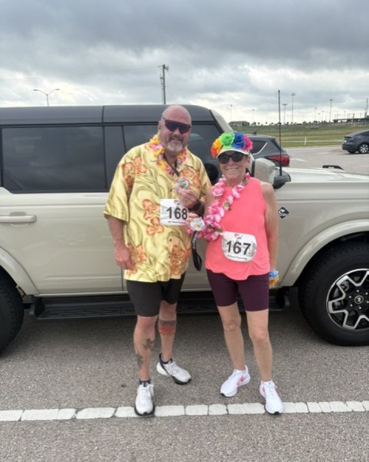 Lennie and Rene Dixon at Luau 5K, 10K, & 13.1M at Temple, TX (20) - 05/16/2026 after earning Best Costume