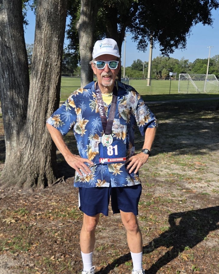 Stephen Savage at Luau 5K, 10K, & 13.1M at Hudson, FL (20) - 05/16/2026 after earning Best Costume