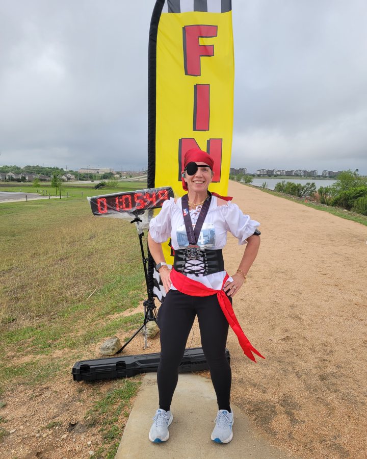 Bridget Mouton at Pirate 5K, 10K, 13.1M & 26.2M at Pflugerville, TX (15) - 04/11/2026 after earning 1st FEMALE Overall