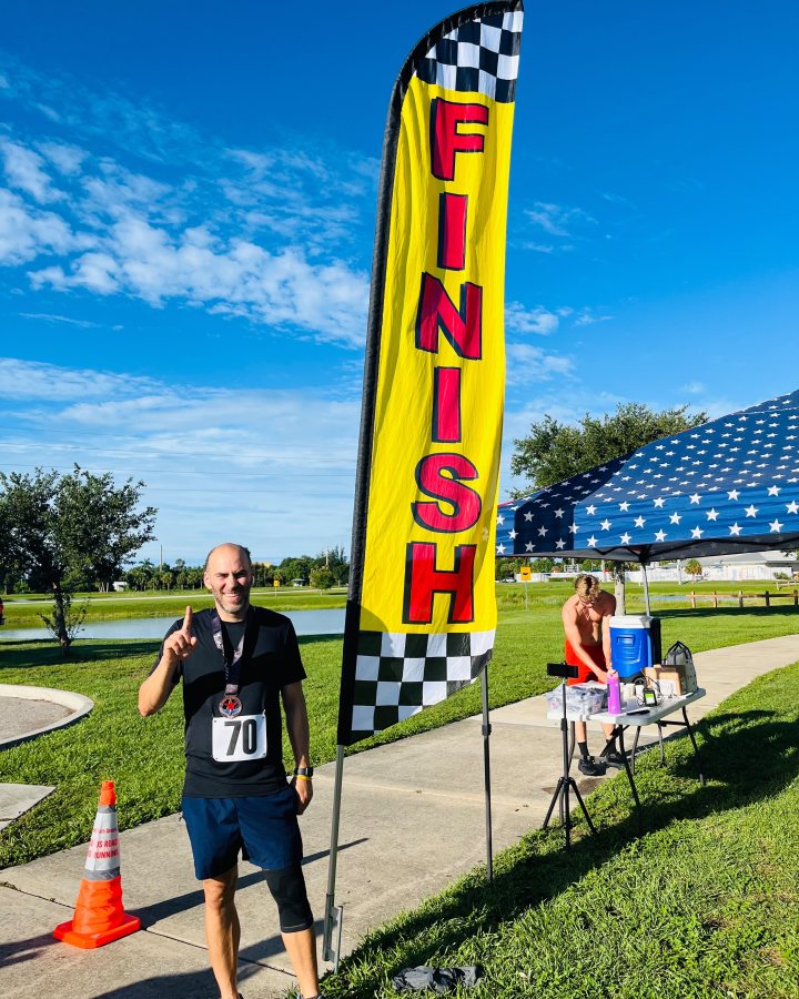 Yusbel Carpio at Eagle 5K, 10K, & 13.1M at Punta Gorda, FL (28) - 07/11/2026 after earning 1st MALE Overall