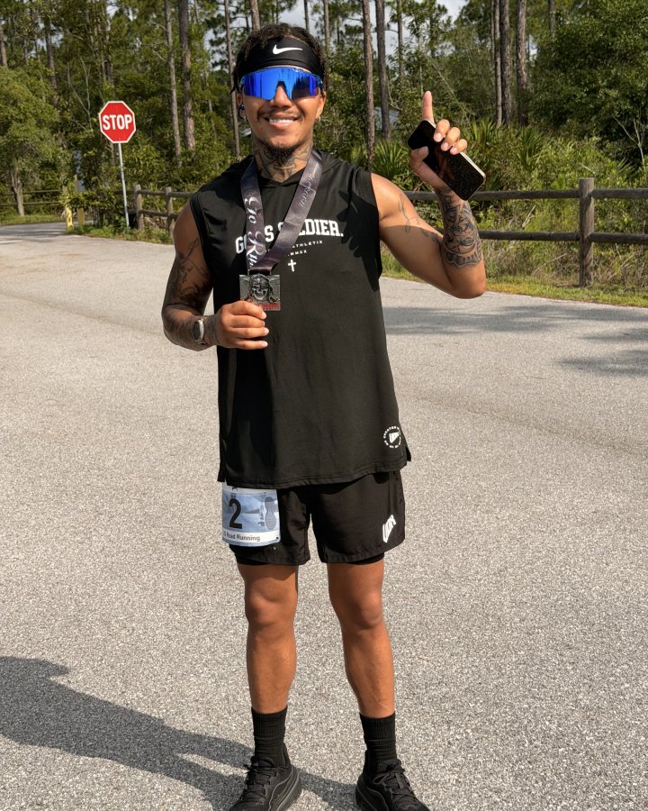 Timmy Evans at Medal Madness 5K, 10K, & 13.1M at Panama City Beach, FL (26) - 06/27/2026 after earning 1st MALE Overall