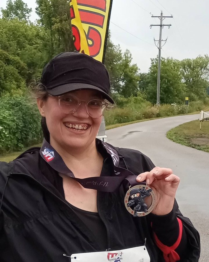 Jennifer McDaniels at Ninja 5K, 10K, & 13.1M at Grand Ledge, MI (31) - 08/01/2026 after earning Best Costume