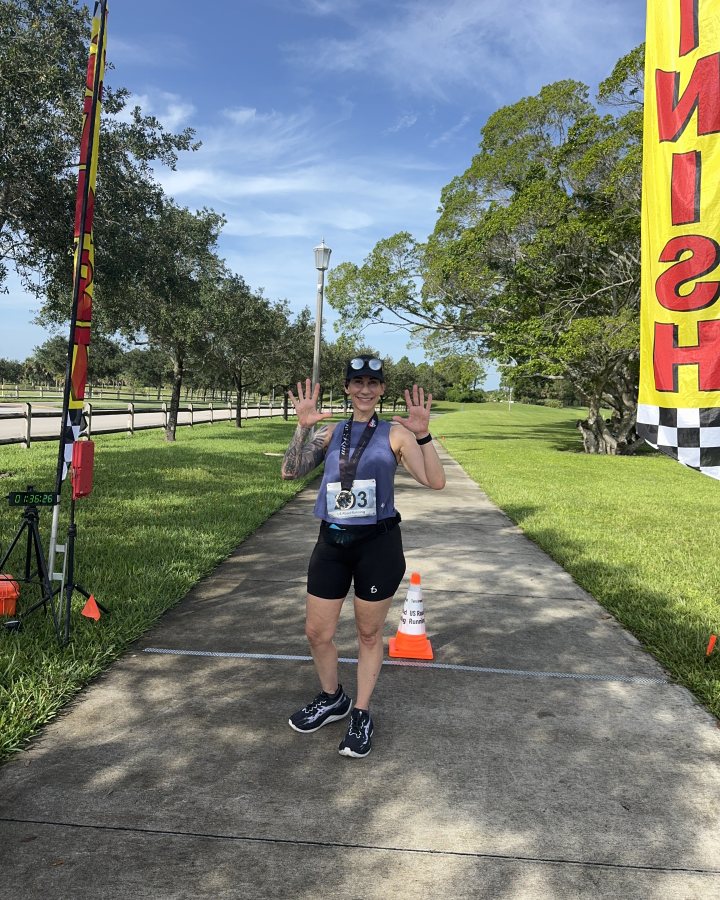 Christen Bellace at Medal Madness 5K, 10K, & 13.1M at Royal Palm Beach, FL (37) - 09/12/2026 after earning 1st FEMALE Overall