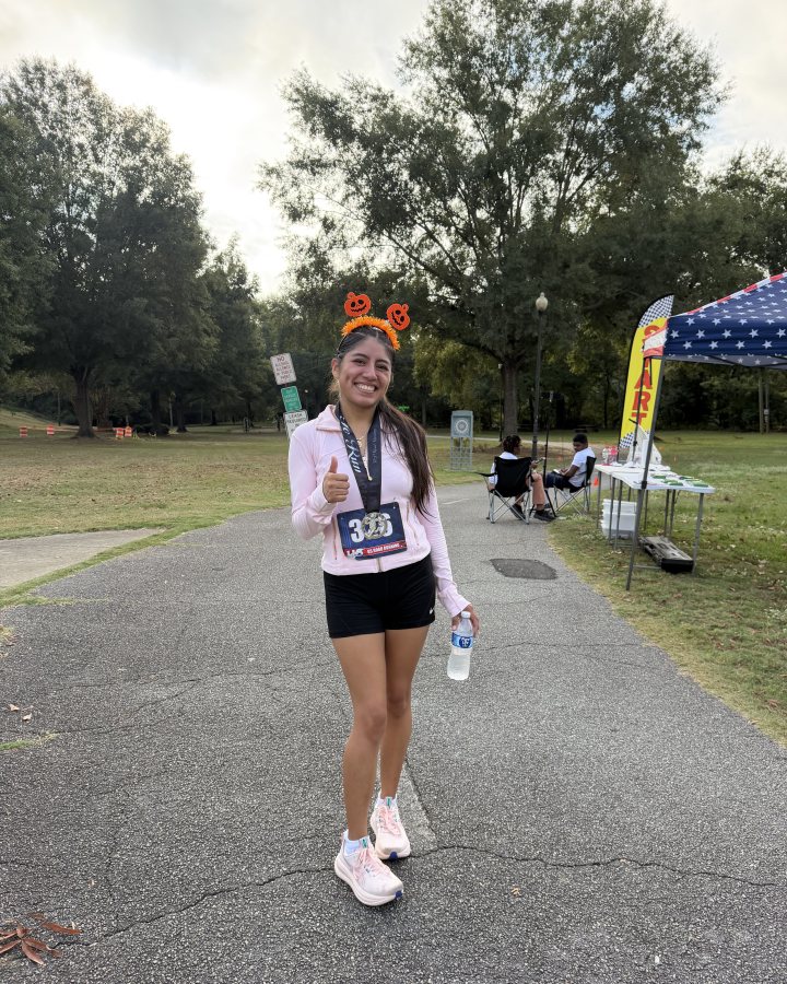 Lesllie Alvarez at Haunted 5K, 10K, 13.1M at Columbus, GA (40) - 10/03/2026 after earning 1st FEMALE Overall