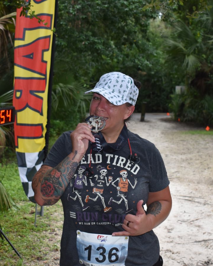 Mary Lopera at Haunted 5K, 10K, & 13.1M at DeBary, FL (42) - 10/17/2026 after earning 1st FEMALE Overall