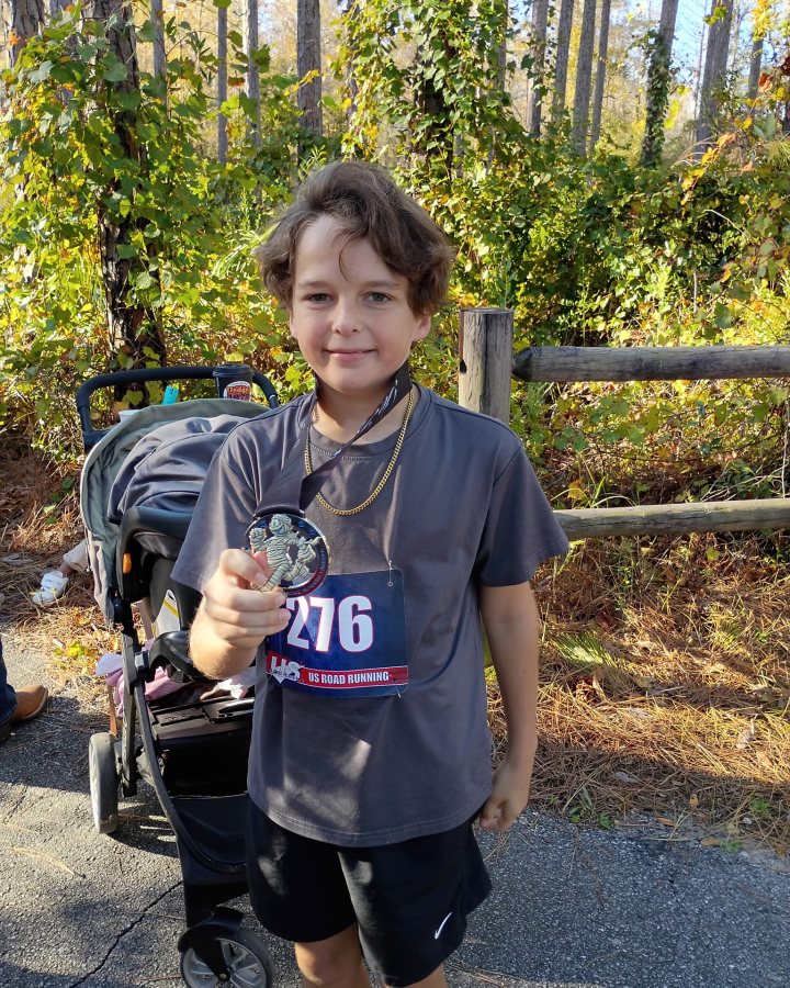Walker Mac Williams at Haunted 5K, 10K & 13.1M at Panama City Beach, FL (43) - 10/24/2026 after earning 1st MALE Overall