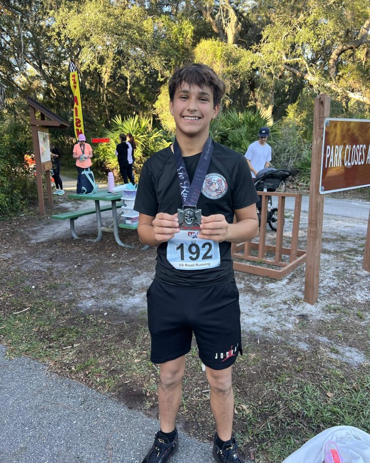 Camdyn Osteen at Haunted 5K, 10K, & 13.1M at New Port Richey, FL (43) - 10/24/2026 after earning 1st MALE Overall